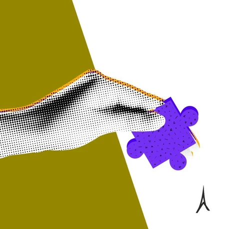 Ręka trzyma kawałka puzzli